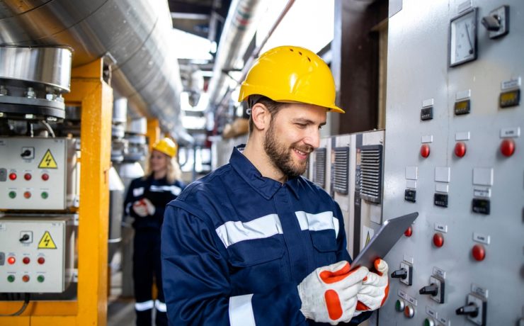 man looking at electrics - why gas and electrics are a smart career move in 2026