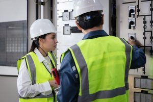 man with woman learning for Electrical installation training
