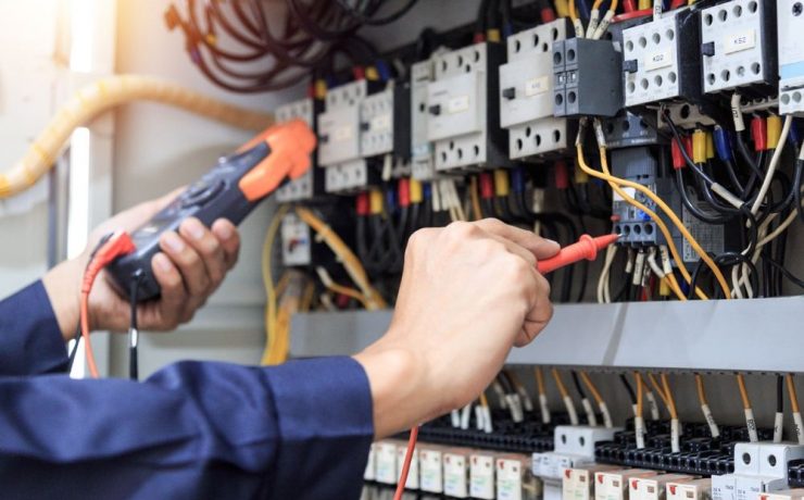 electrical engineer hands working on electrics