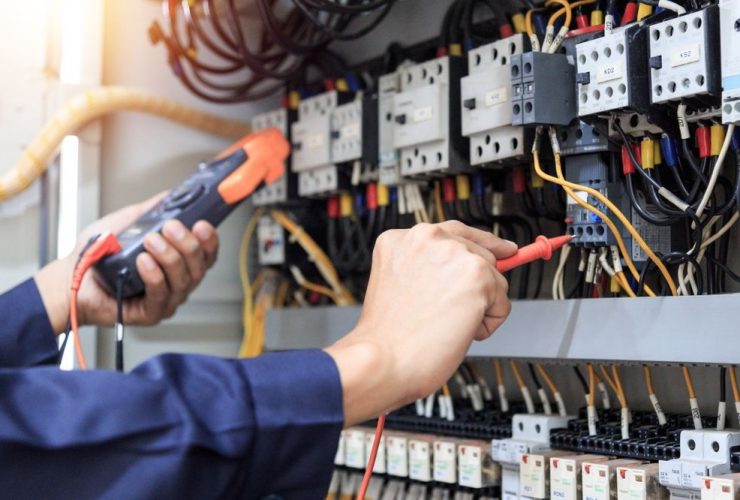 electrical engineer hands working on electrics