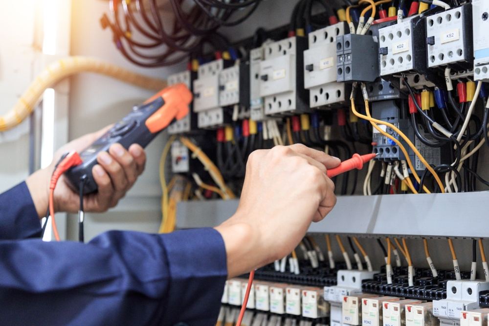 electrical engineer hands working on electrics