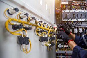 electrical safety man working on wiring for electrical safety tips
